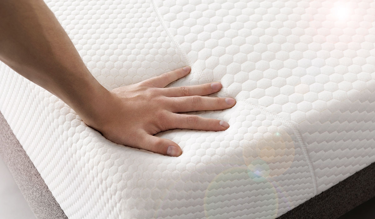 person touching mattress