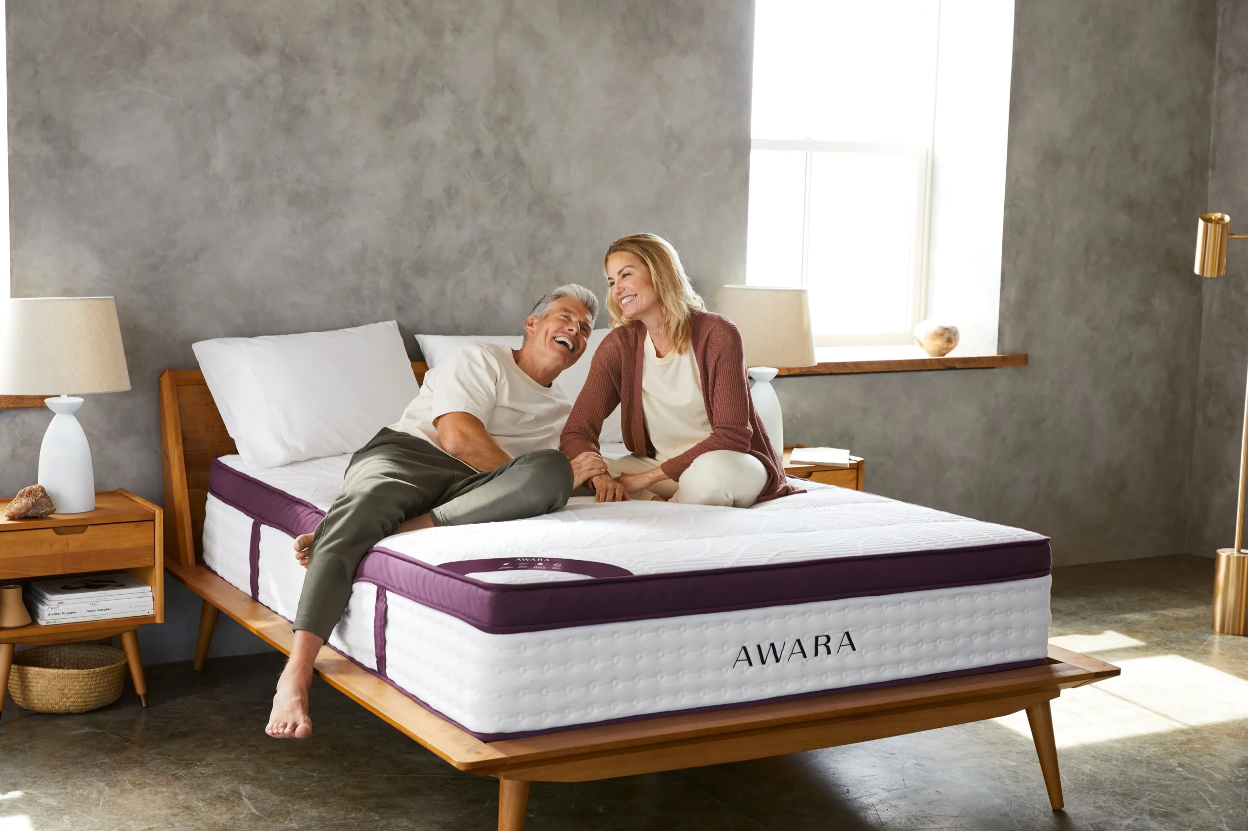 couple sitting on awara mattress