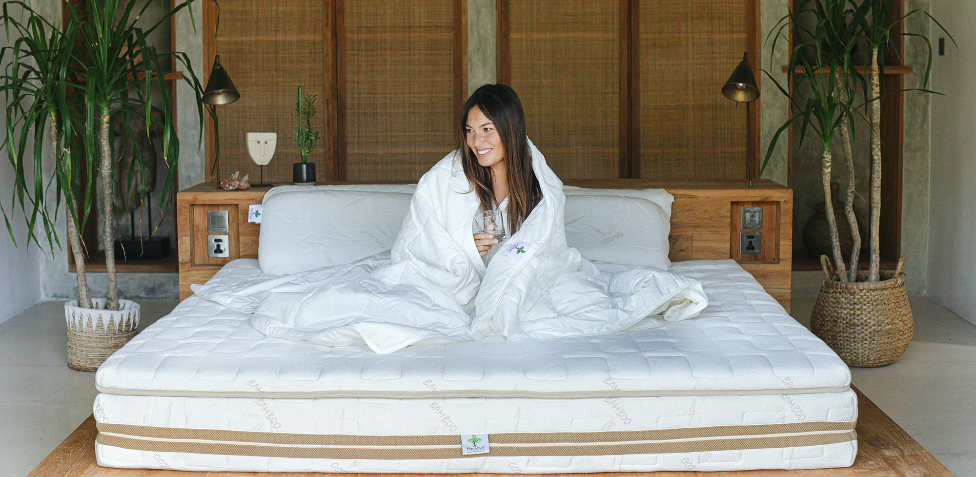 woman sitting on latex mattress