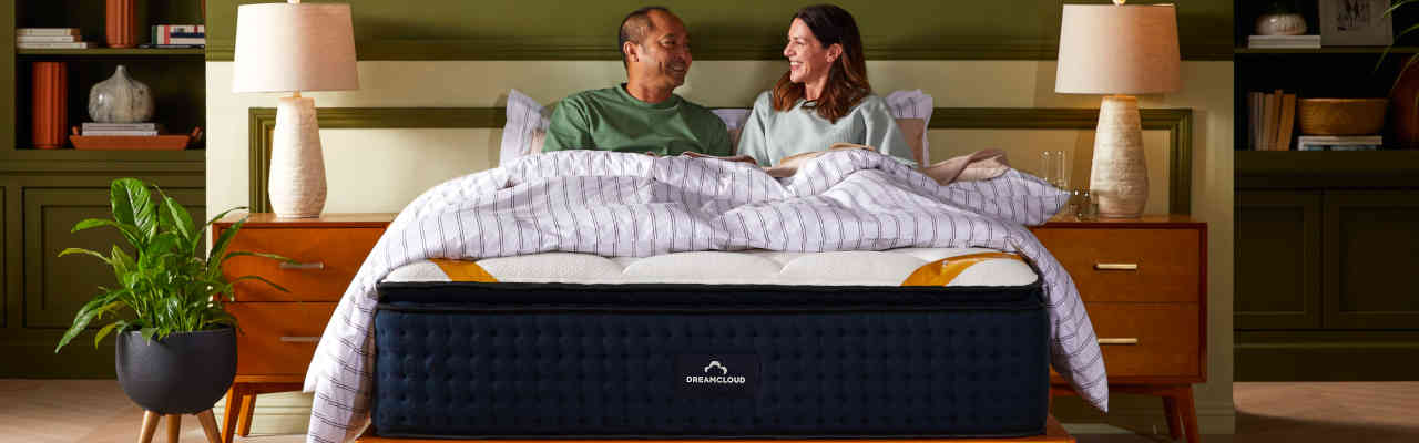 couple sleep on dreamcloud hybrid mattress